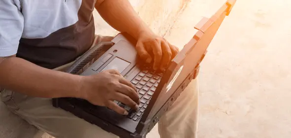 Wan working on a laptop