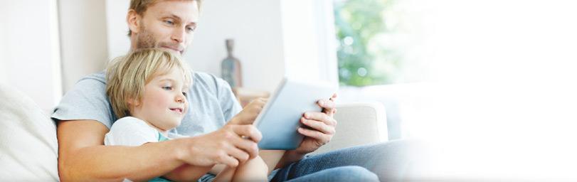 Father and child reading on the couch